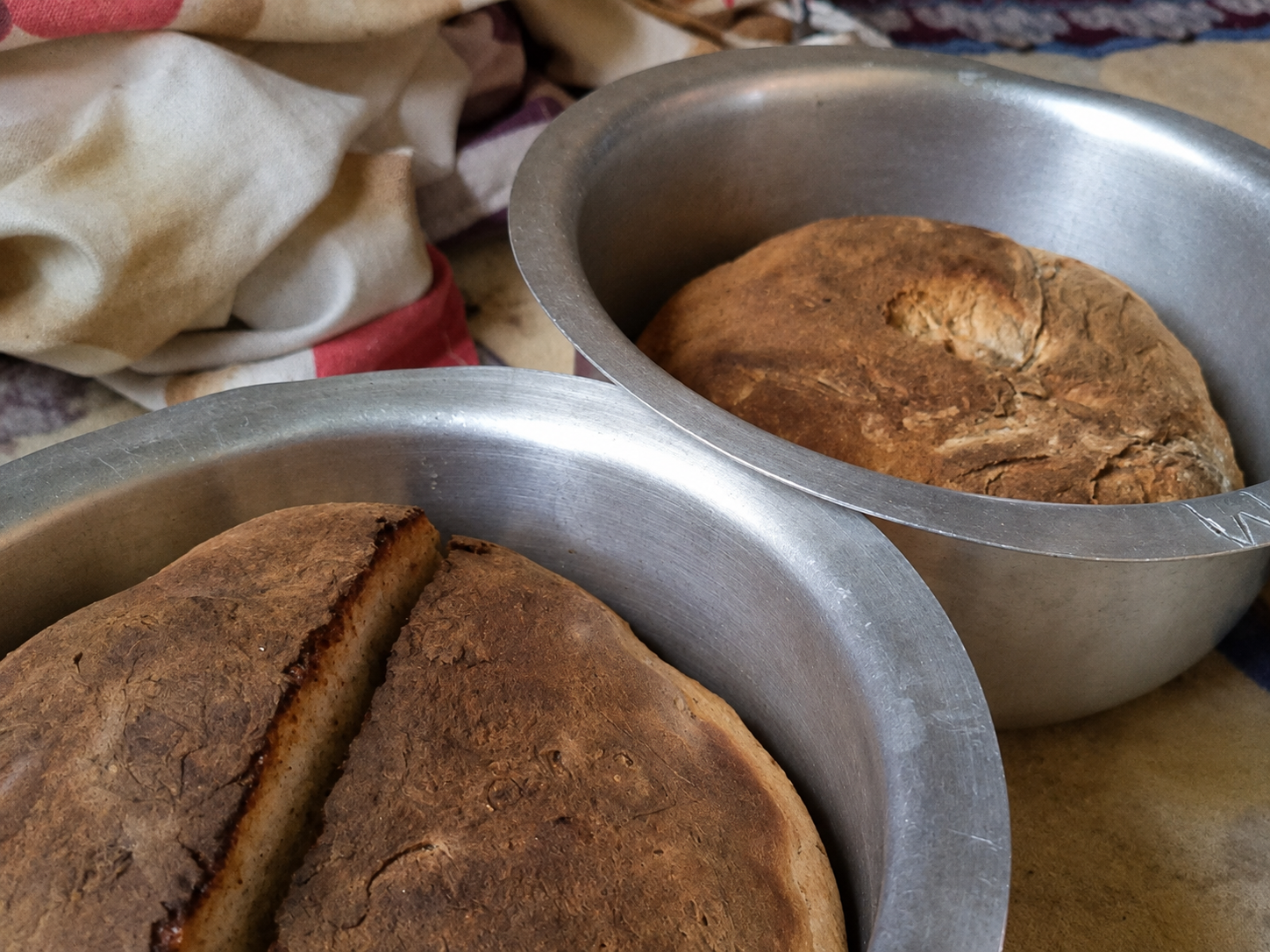 Loaves of bread baked in the finished earthen oven