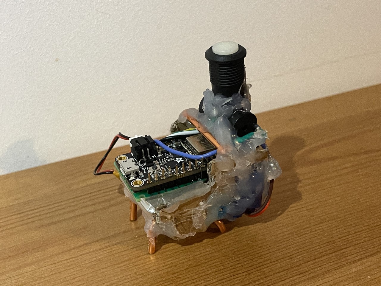 The llama bot opened up to show the internal electronics and structure